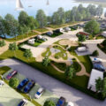 Grafika przedstawia wizualizację camper parku. Wizualizacja obejmuje parking, koło jeziora, na którym znajdują się samochody oraz campery.